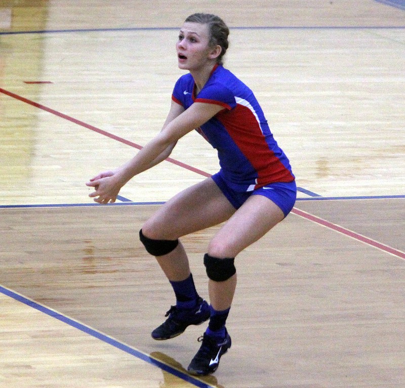 California senior Ellie Wirts gets ready for a dig in last Tuesday's match against Hallsville.