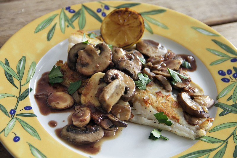 This Oct. 6, 2016 photo shows cod with red wine pan sauce and mushrooms in Coronado, Calif. This dish is from a recipe by Melissa d'Arabian. (Melissa d'Arabian via AP)