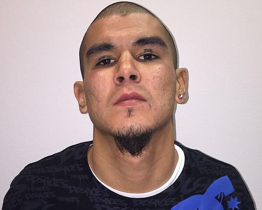 This photo released by Fairbanks Police Department shows Anthony George Jenkins-Alexie. The 29-year-old man was arrested in a shooting that left an Alaska police officer seriously injured. Jenkins-Alexie, of Fairbanks, is facing charges of attempted murder, assault and other counts in connection with the shooting early Sunday of Sgt. Allen Brandt.