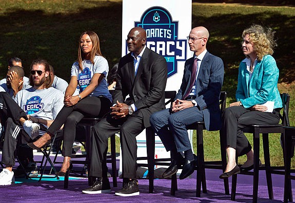 Hornets owner Michael Jordan (center), with NBA commissioner Adam Silver and Charlotte mayor Jennifer Roberts (far right) attend the dedication of basketball courts Tuesday by the Hornets and NBA at Latta Park in Charlotte, N.C.