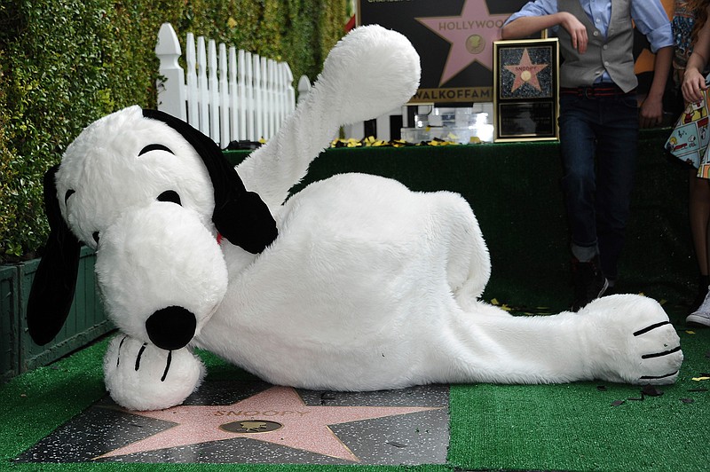 In a Nov. 2, 2015 file photo, Snoopy is honored with a star on the Hollywood Walk of Fame, in Los Angeles. MetLife announced Thursday, Oct. 20, 2016 that they will phase out its use of Snoopy and the Peanuts Gang as a brand after more than 30 years. MetLife will be rolling out the new brand globally through 2017.