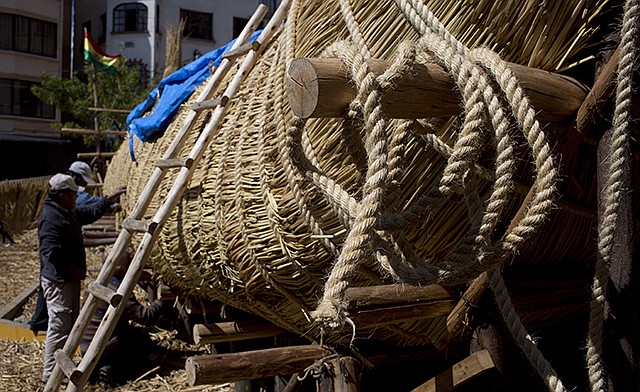 Workers continue construction of a reed boat named the "Viracocha III," and built by Bolivian Aymara Indians, Wednesday in La Paz, Bolivia. American explorer Phil Buck is preparing to cross the Pacific Ocean from South America to Australia in the Viracocha III.