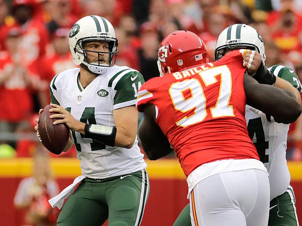 Jets quarterback Ryan Fitzpatrick looks downfield as center Nick Mangold blocks Chiefs defensive lineman Allen Bailey during a game earlier this season at Arrowhead Stadium.