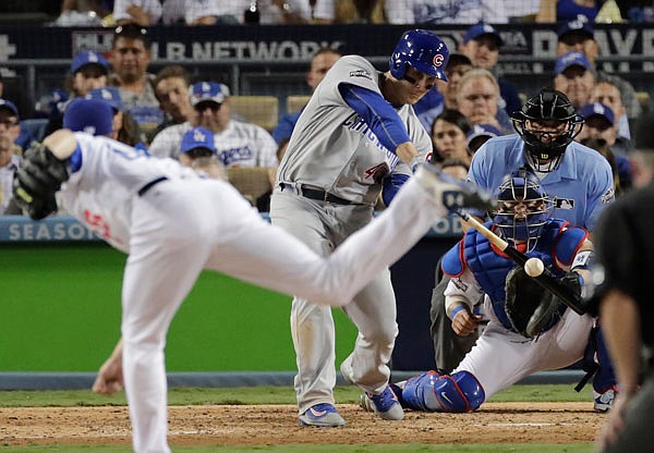 Anthony Rizzo of the Cubs hits a two-run single during the sixth inning of Wednesday's Game 4 of the National League Championship Series against the Dodgers in Los Angeles.