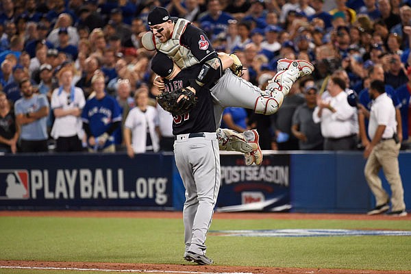 Indians relief pitcher Cody Allen and catcher Roberto Perez celebrate Wednesday's 3-0 win against the Toronto Blue Jays during Game 5 of the American League Championship Series in Toronto.