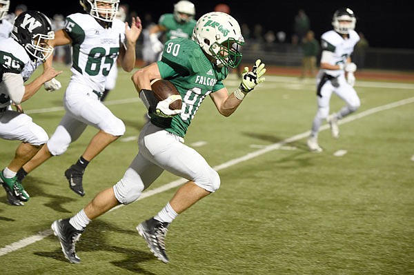 Blair Oaks wide receiver Ben Thomas runs past the Warsaw defense for a touchdown during last Friday night's game against the Wildcats at the Falcon Athletic Complex in Wardsville. Thomas has seven touchdown receptions this season.