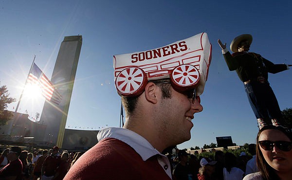 Oklahoma fan Grayson Niemeyer wears a hat before the game with Texas earlier this onth in Dallas.