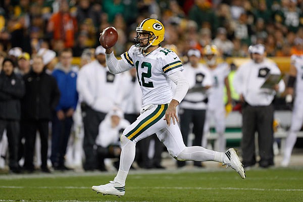 Packers quarterback Aaron Rodgers runs against the Bears during Thursday night's game in Green Bay, Wis.