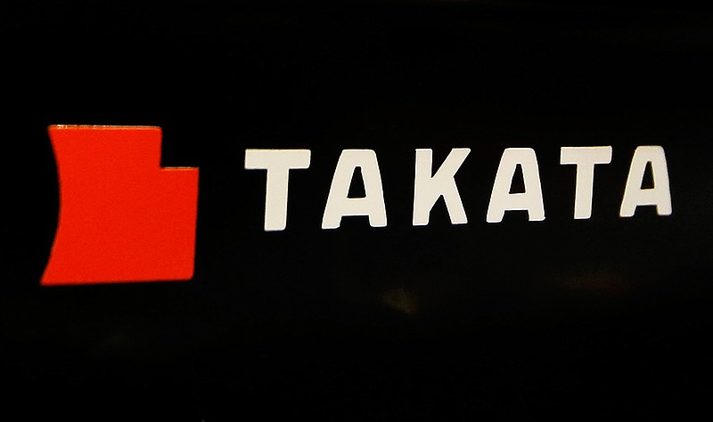 This July 6, 2016, file photo, shows the logo of Takata Corp. at an auto supply shop in Tokyo. The U.S. government is confirming another death due to the rupture of an air bag made by Takata Corp. The National Highway Traffic Safety Administration says a 50-year-old woman died Sept. 30, 2016, in Riverside County, in California. Honda Motor Co. also confirmed the woman's death and said she was driving a 2001 Civic. 