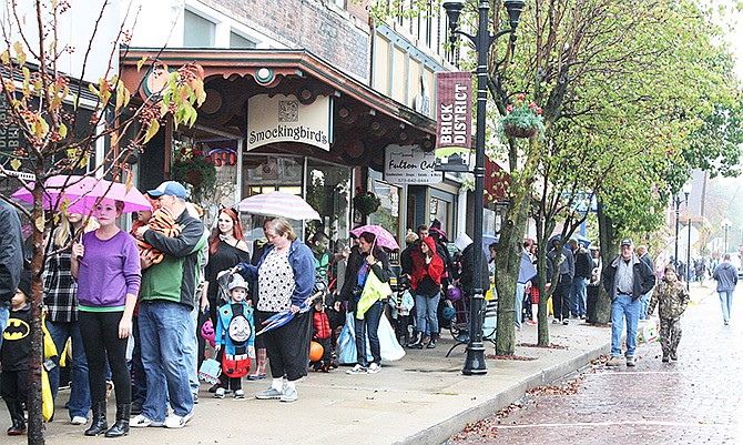 Fulton residents lined up Court Street for the trick-or-treat event last year. 