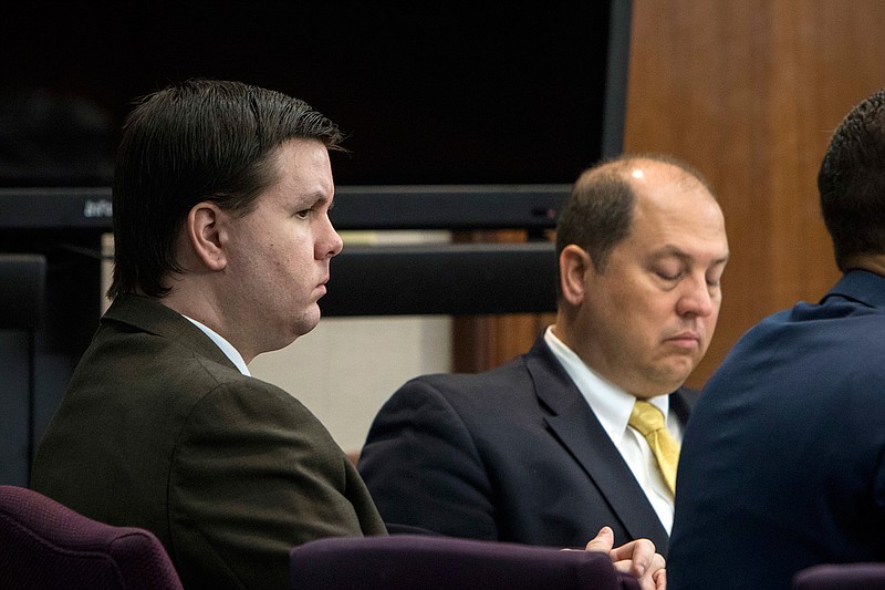 In this Oct. 3, 2016 file photo, Justin Ross Harris, left, listens to jury selection during his murder trial at the Glynn County Courthouse in Brunswick, Ga.  Harris, 34, is charged with murder in the death of his 22-month-old son, Cooper. He's also charged with sending graphic, sexual text messages and photos to a girl for a period of several months when she was 16 and 17. 