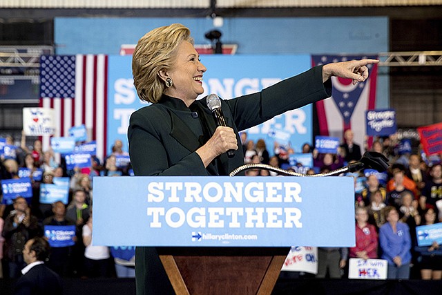 Democratic presidential candidate Hillary Clinton points to the crowd Friday while speaking at a rally at Cuyahoga Community College in Cleveland, Ohio.