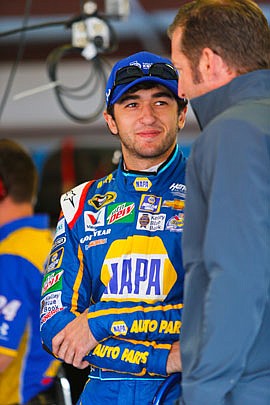 Chase Elliott hangs out in the garage area before Friday's practice at Talladega Superspeedway in Talladega, Ala.