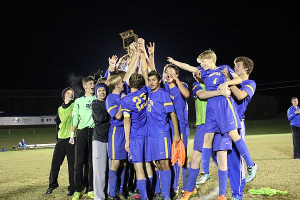 The Fatima Comets celebrate Friday night after defeating Springfield Catholic for the Class 2 District 11 Tournament title at Knights of Columbus Field near Westphalia.