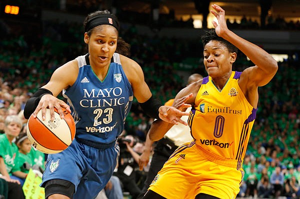 Maya Moore of the Lynx drives around Alana Beard of the Sparks Oct. 20, 2016, during a game in Minneapolis.