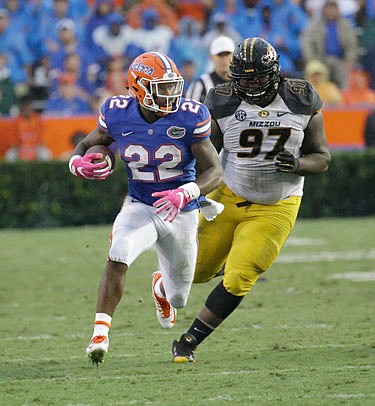 Josh Augusta of Missouri tries to chase down Florida running back Lamical Perine during last Saturday night's game in Gainesville, Fla.