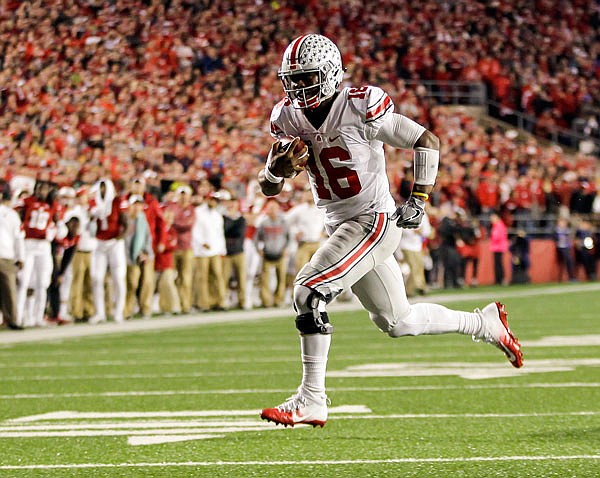 Ohio State quarterback J.T. Barrett runs in open space last Saturday against Wisconsin in Madison, Wis.