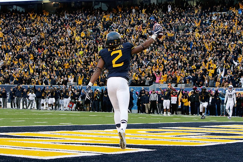 West Virginia wide receiver Ka'Raun White (2) celebrates his touchdown catch during the second half of an NCAA college football game against TCU, Saturday, Oct. 22, 2016, in Morgantown, W.Va. West Virginia 34-10. 