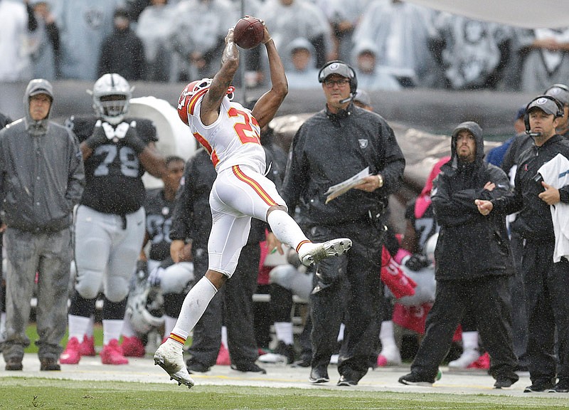 Chiefs cornerback Marcus Peters intercepts a pass against the Raiders during last Sunday's game in Oakland, Calif.