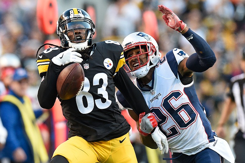 Pittsburgh Steelers wide receiver Cobi Hamilton (83) cannot hang onto a pass from quarterback Landry Jones during the first half of an NFL football game with New England Patriots cornerback Logan Ryan (26) defending in Pittsburgh, Sunday, Oct. 23, 2016. 