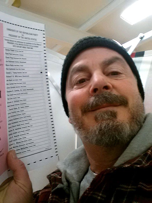 Bill Phillips, of Nashua, N.H., Phillips takes a selfie with his marked election ballot. The secrecy of the voting booth may soon be a thing of the past. Ballot selfies, where people use smartphones to photograph and share their marked ballots online, are becoming more common, as voters young and old look to share their views with family, friends and the world. But what they don't realize is they may be breaking the law, depending on where they live. 