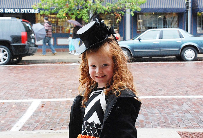 London Fountain, 5, poses for a picture dressed as a witch during the Brick District trick-or-treat event last year. This year's event will be 4-6 p.m. Monday on Court Street in downtown Fulton.