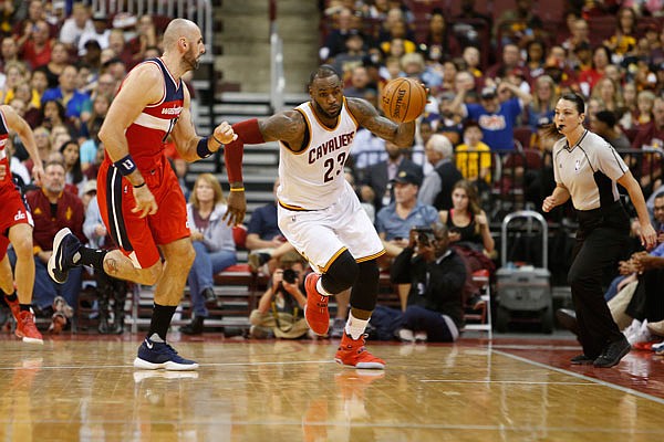 LeBron James of the Cavaliers dribbles the ball up the court against the Wizards during a NBA preseason game earlier this month in Columbus, Ohio.