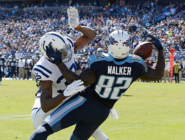 Titans tight end Delanie Walker reaches for a pass as he is defended by Colts free safety T.J. Green in the first half of Sunday afternoon's game in Nashville, Tenn. Green was called for pass interference on the play, one of 58 Colts' penalties this season.