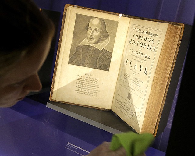 Book conservator Lauren Schott polishes a case containing 17th century editions of plays attributed to William Shakespeare in an exhibit called "Shakespeare Unauthorized" at the Boston Public Library, in Boston, Massachusetts. Oxford University Press' new edition of William Shakespeare's works will credit Christopher Marlowe as co-author of the three Henry VI plays, underscoring the playwright collaborated with others on some of his most famous works.