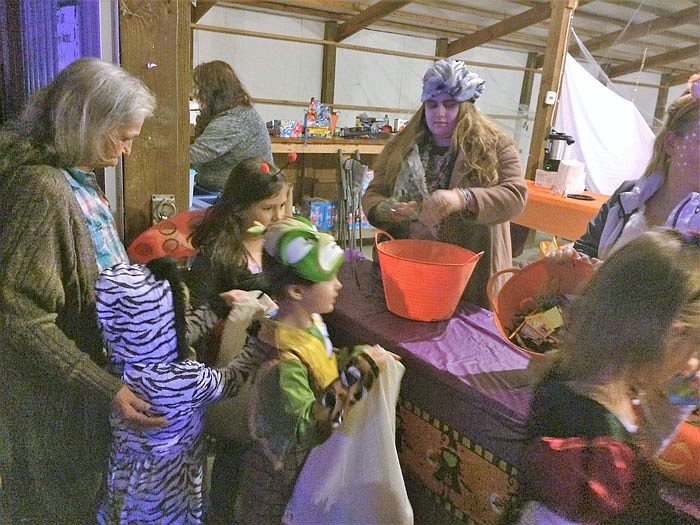 Children walk through the Trunk-or-Treat line Saturday at the Callaway County Fairgrounds. The event was a fundraiser for the Shop with a Hero program.