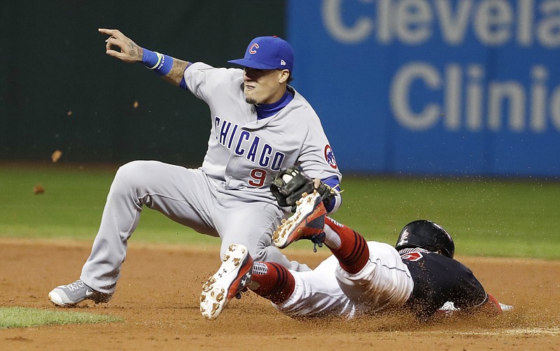 Chicago Cubs' Javier Baez tags out Cleveland Indians' Jose Ramirez as he is caught stealing second during the third inning of Game 1 of the Major League Baseball World Series Tuesday, Oct. 25, 2016, in Cleveland. 