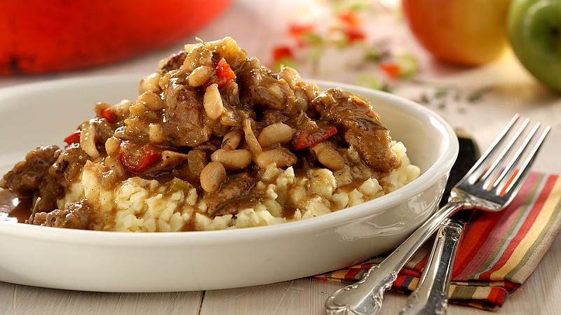 Cider goes into the braising liqud for a lamb stew enhances with red peppers and white beans and served over sour cream and apple mashed potatoes.