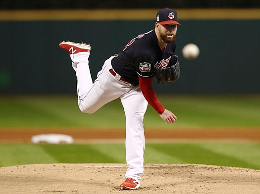 Indians starting pitcher Corey Kluber throws to the plate during Tuesday night's game against the Cubs in Cleveland.