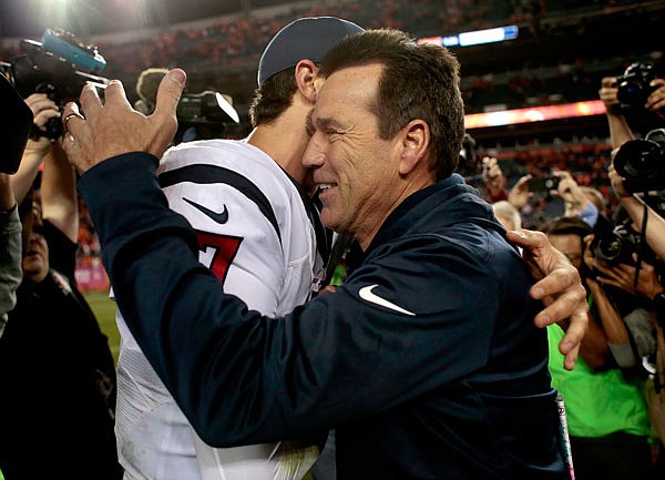 Texans quarterback Brock Osweiler greets Broncos head coach Gary Kubiak after Monday night's game in Denver.