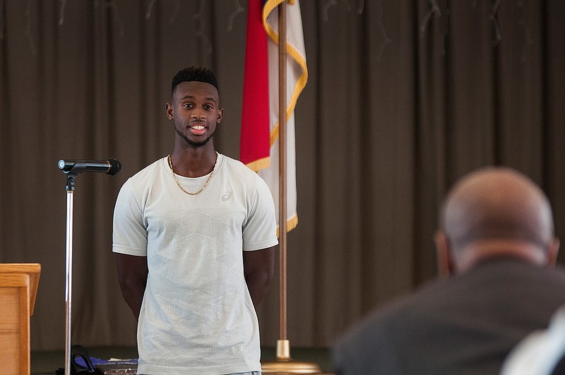 Local track and field athlete Jarrion Lawson, who competed in the 2016 Olympic Games, speaks after being awarded the Daniel E. Haskins Educational Scholarship Saturday during the 13th annual Macedonia-Eylau Community in Action Day in the Park. 