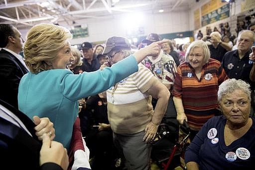 Democratic presidential candidate Hillary Clinton greets members of the audience after speaking at a rally at Palm Beach State College in Lake Worth, Fla., Wednesday, Oct. 26, 2016.