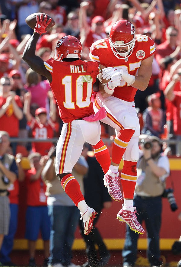 Chiefs wide receiver Tyreek Hill celebrates with tight end Travis Kelce after scoring a touchdown during the first half of Sunday's game against the Saints at Arrowhead Stadium in Kansas City.