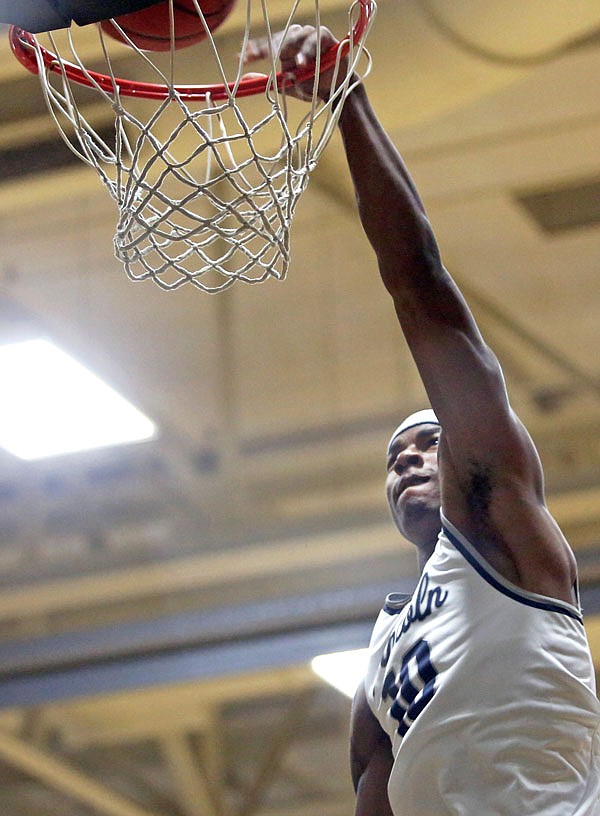Lincoln senior guard Jaylon Smith goes up for a dunk during a scrimmage Wednesday night during the Blue Tigers' annual Blue Madness event at Jason Gym. The event offered Lincoln fans their first chance to see the 2016-17 men's and women's basketball teams.
