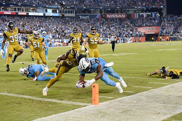 Titans running back DeMarco Murray beats Jaguars safety Johnathan Cyprien to the end zone during Thursday night's game in Nashville.