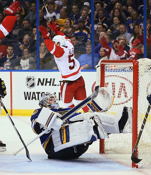 Red Wings center Frans Nielsen (background) reacts after scoring a short-handed goal against Blues goalie Jake Allen in the second period of Thursday's game in St. Louis.