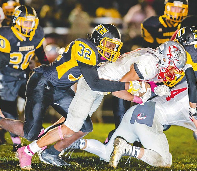 Fulton junior linebacker LeCheyon Williams takes down Mexico junior running back Cameron Holman during the Hornets' 40-20 North Central Missouri Conference loss to the Bulldogs on Oct. 7, 2016 in Fulton, Mo.