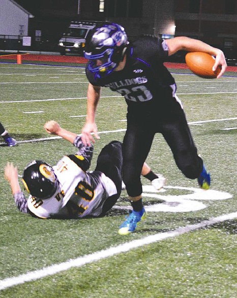 South Callaway junior running back Kaden Helsel dashes past a fallen Van-Far defender during the No. 9 Bulldogs' 48-0 Eastern Missouri Conference victory over the Indians on Oct. 14, 2016 in Mokane, Mo.