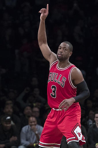 Chicago Bulls guard Dwyane Wade (3) gestures after scoring a 3 point goal during the first half of an NBA basketball game against the Brooklyn Nets, Monday, Oct. 31, 2016, in New York. 