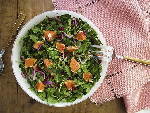 Red onion, blood oranges and pomegranate seeds pack this salad with both tart and sweet flavors.