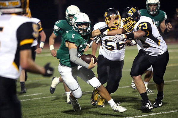 Nolan Hair of Blair Oaks fends off Fulton players during last Friday night's game at the Falcon Athletic Complex in Wardsville.