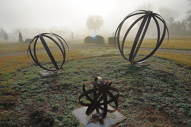 When the cool, damp air met with the warm morning sun on Friday, Nov. 4, 2016, a thick layer of fog was created in low-lying areas, including the Missouri River bottom in north Jefferson City, which made for a stunning visual at the James D. Schwieterman Memorial Garden.