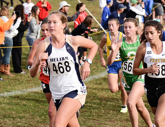 Kayla Yanskey of Helias looks ahead Saturday, Nov. 5, 2016 as she strides past a group of runners during the Missouri Class 3 cross country championships at Oak Hills Golf Center in Jefferson City. Yanskey finished 10th to earn her fourth all-state honor.
