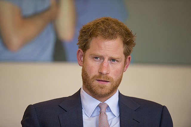 Britain's Prince Harry takes part in a round table discussion July 7 with HIV doctors at King's College Hospital in south London as part of his desire to learn more and raise public awareness in the fight against HIV and AIDS both internationally and in the UK. Britain's Prince Harry has condemned racist abuse and harassment of his girlfriend Meghan Markle in the media, issuing a highly unusual statement Tuesday that confirmed the relationship and expressed concern for her safety.