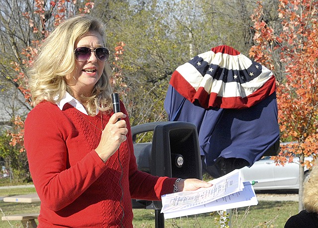 Jeannine Brickey, Capital Garden Club member, was the master of ceremonies Friday at the dedication of Missouri's 97th Blue Star Memorial in Russellville's Railroad Park.