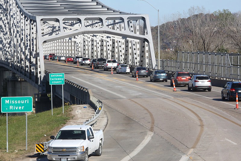 Traffic backs up on the eastbound Missouri River bridge in Jefferson City Saturday. In order to fully open both bridges by the Monday deadline, the eastbound bridge had to be reduced to one lane Friday night so it could be re-striped for one-way traffic, since it had been carrying both eastbound and westbound traffic since May.